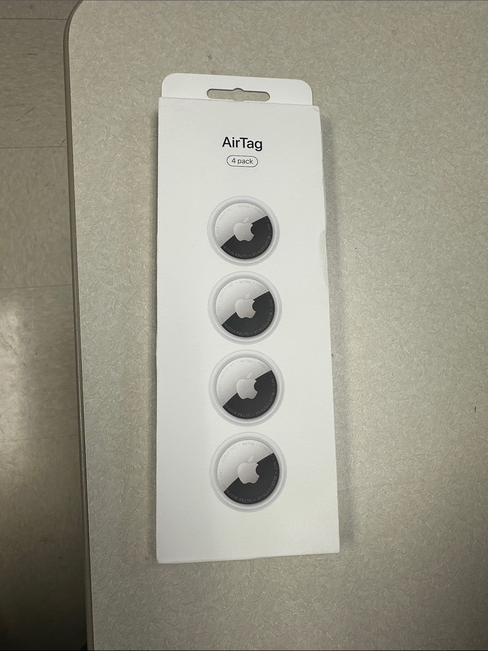 Apple AirTag 4-Pack β White and Silver Trackers. Unopened.